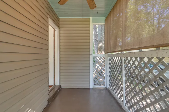a view of a door and wooden floor