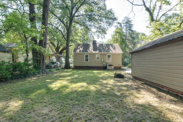 a view of a backyard with a tree