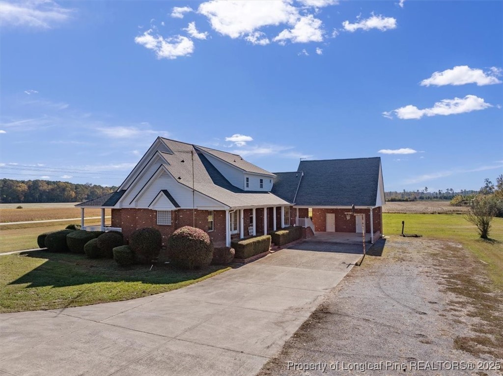 1594 Carroll Store Road Autryville, NC 28318 - Photo 2 of 36 a view of a house with a yard