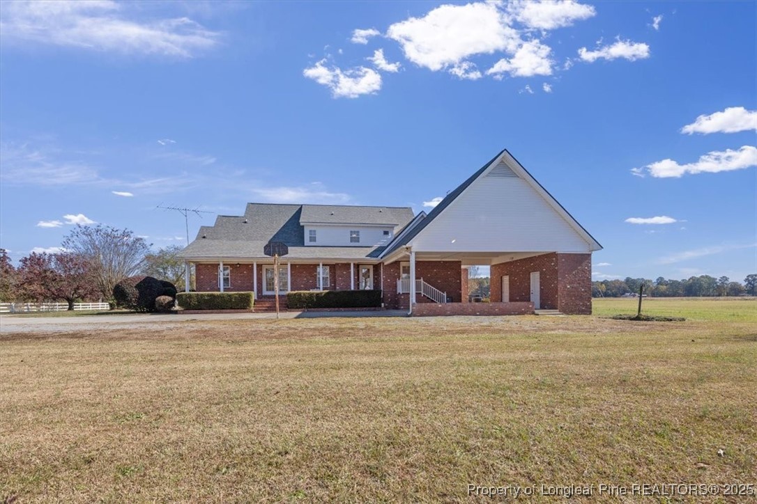 1594 Carroll Store Road Autryville, NC 28318 - Photo 3 of 36 a big room with big yard and large trees