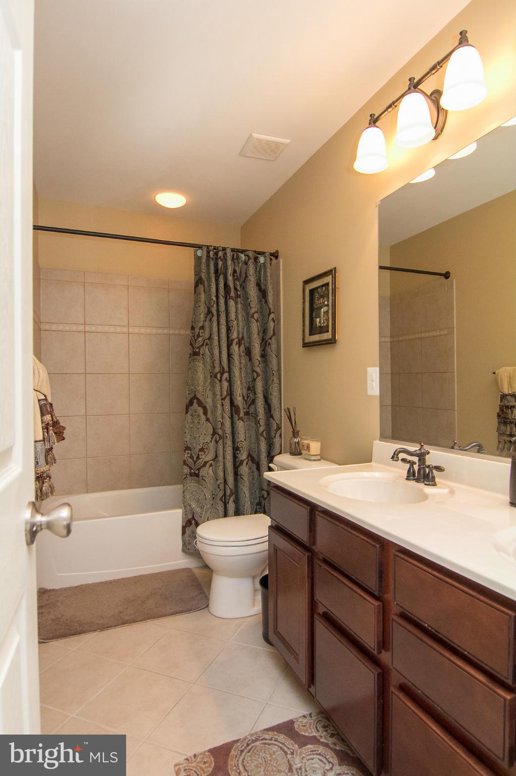 4915 Pale Morning Dun Road Elkridge, MD 21075 - Photo 22 of 27 Hall bath w/ceramic tile