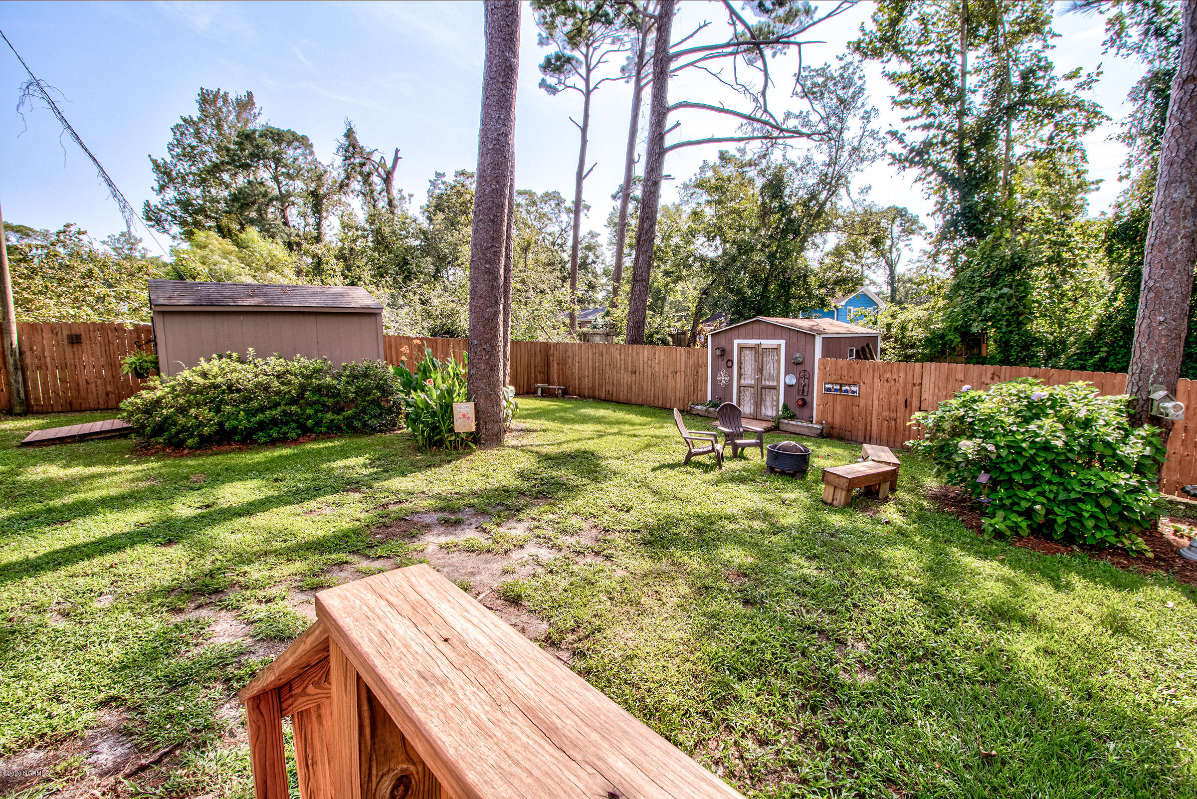 4113 Masonboro Loop Road Wilmington, NC 28409 - Photo 25 of 31 Large private backyard with mature landscaping.
