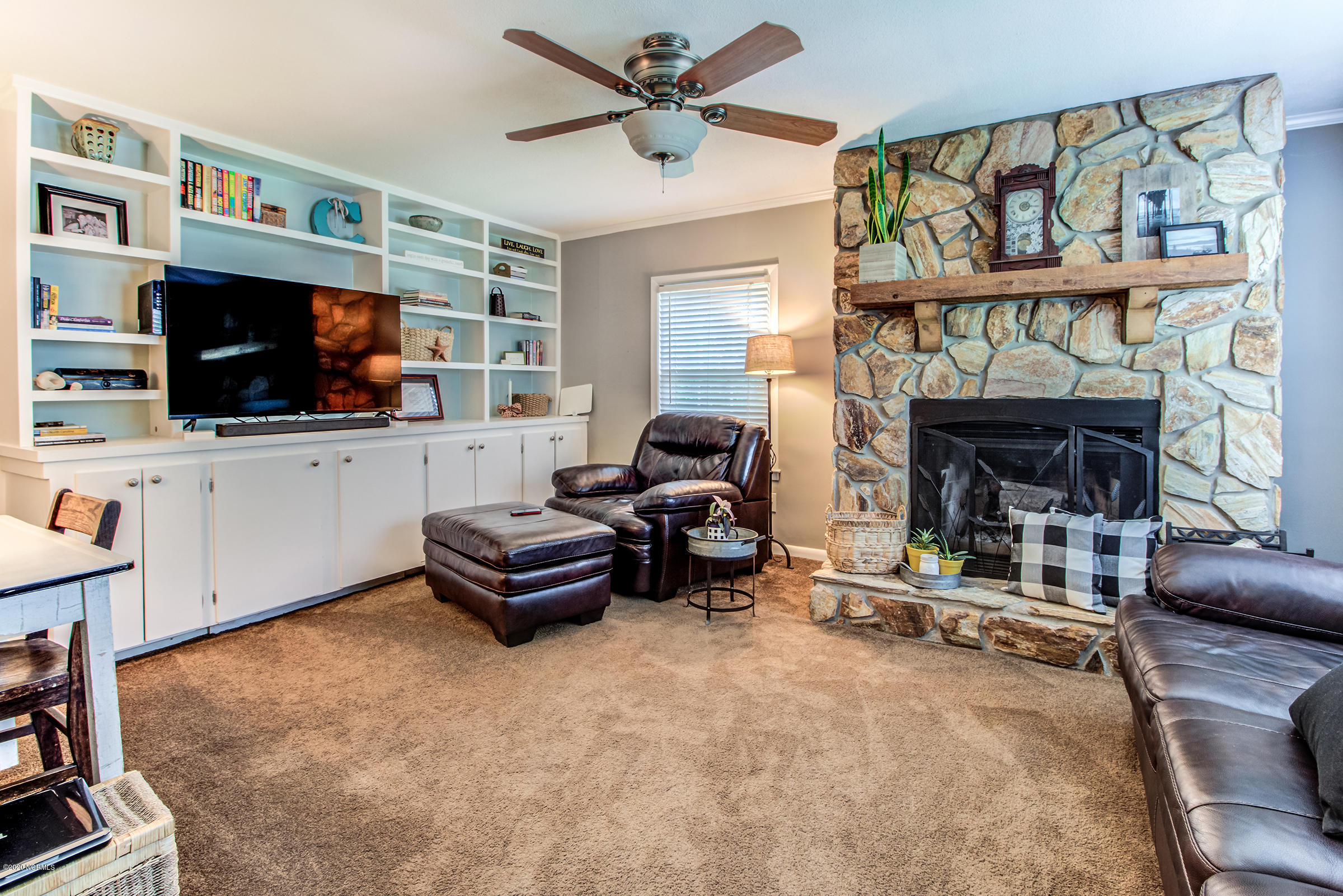 4113 Masonboro Loop Road Wilmington, NC 28409 - Photo 7 of 31 Family Room with fireplace and built in bookshelves