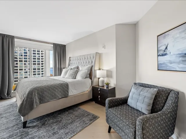 a bedroom with a bed and couch