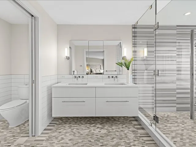 a white bath tub sitting next to a shower