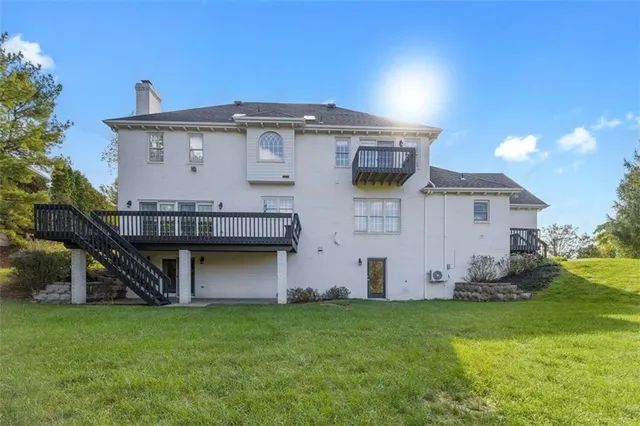 an aerial view of house with yard swimming pool and outdoor seating