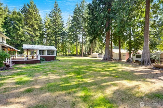 a view of a house with a backyard