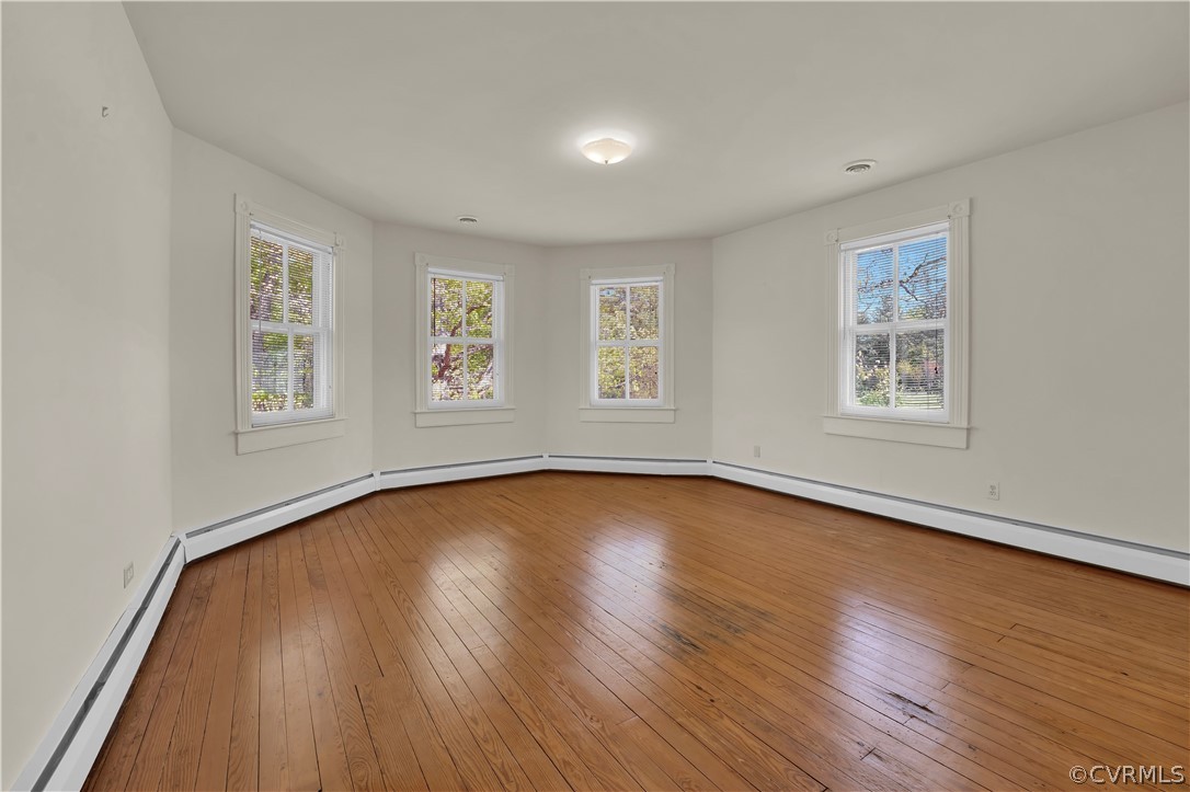 20011 Genito Road Moseley, VA 23120 - Photo 20 of 50 a view of empty room with window and wooden floor