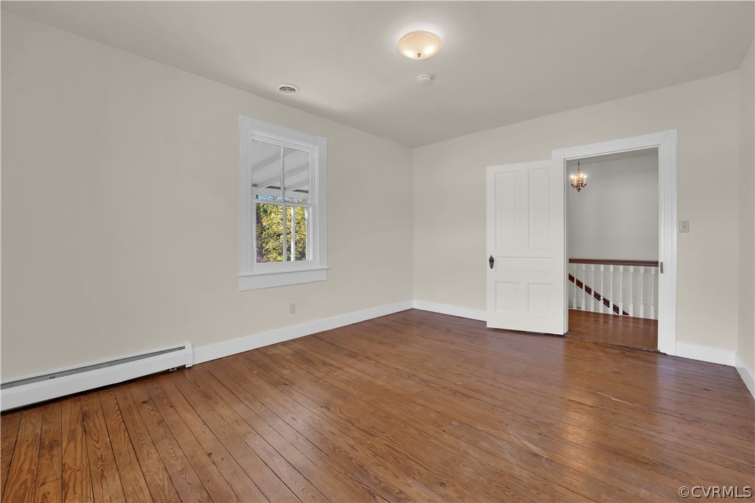 20011 Genito Road Moseley, VA 23120 - Photo 26 of 50 an empty room with wooden floor and windows
