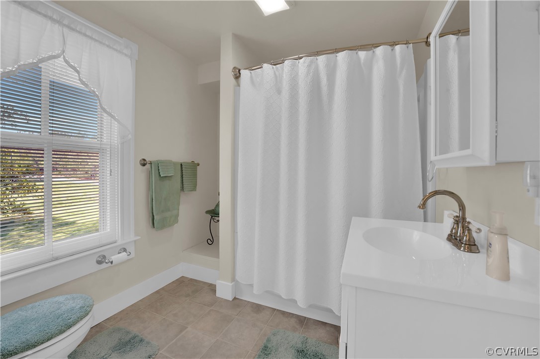 20011 Genito Road Moseley, VA 23120 - Photo 28 of 50 a bathroom with a sink and a mirror