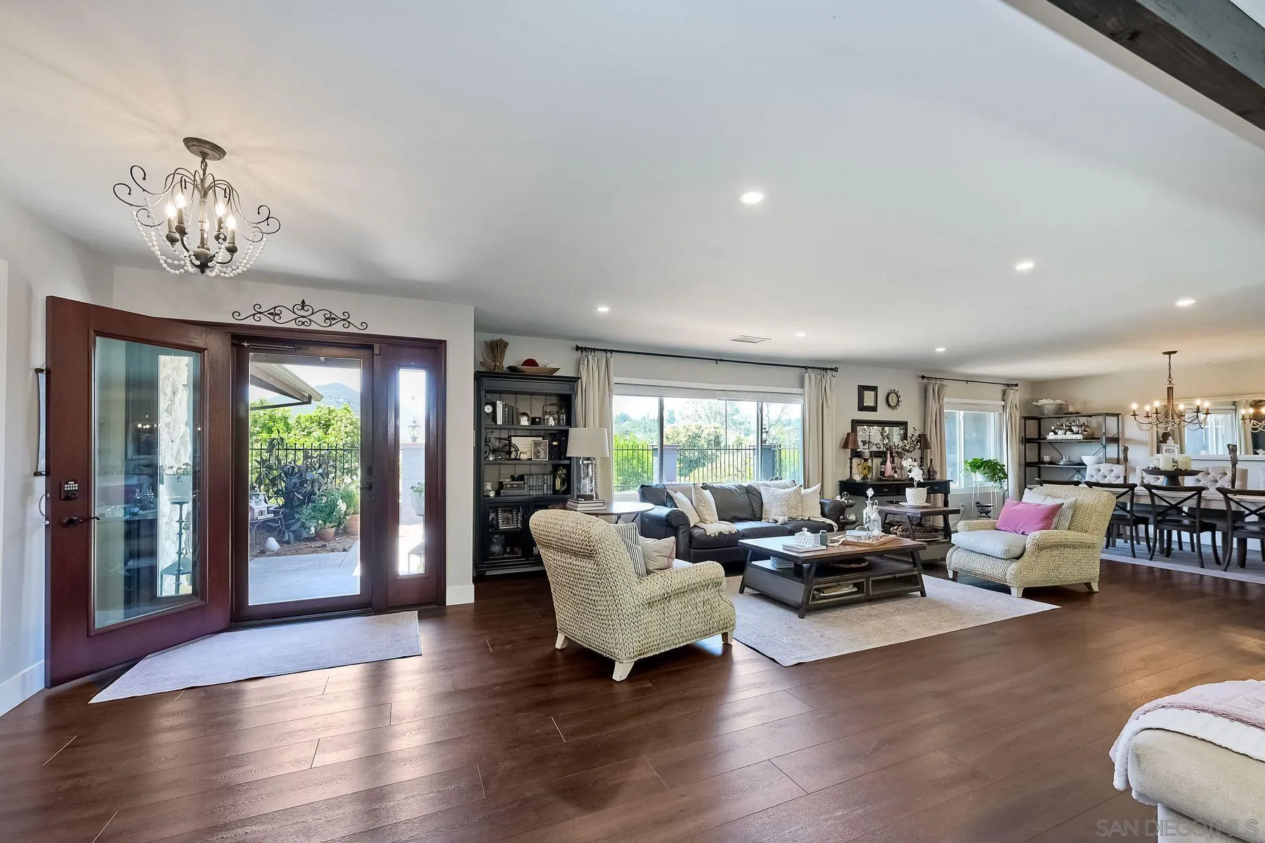 660 Via Rancho Parkway Escondido, CA 92029 - Photo 12 of 37 a living room with furniture floor to ceiling window and wooden floor