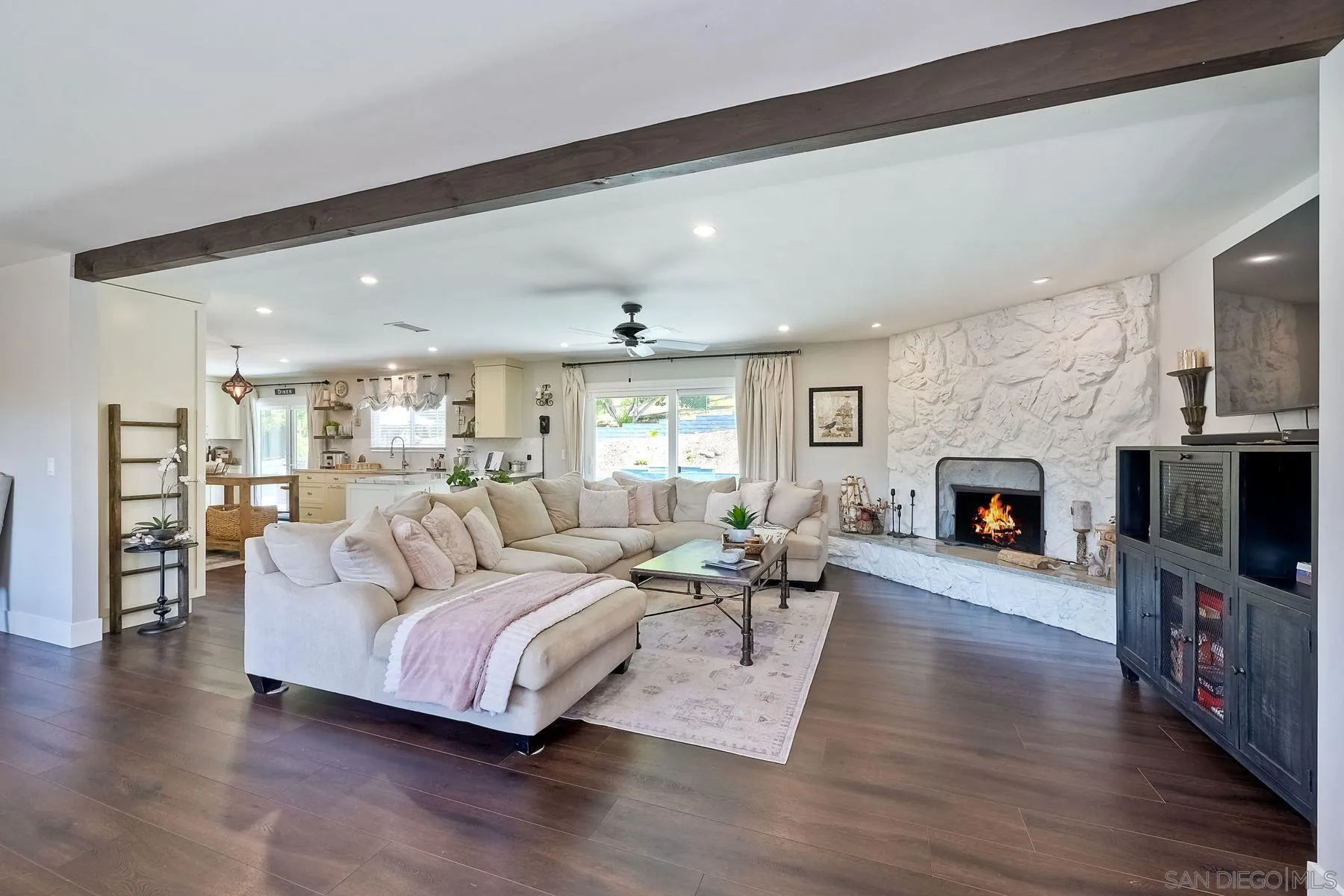660 Via Rancho Parkway Escondido, CA 92029 - Photo 13 of 37 a living room with furniture flat screen tv and a fireplace