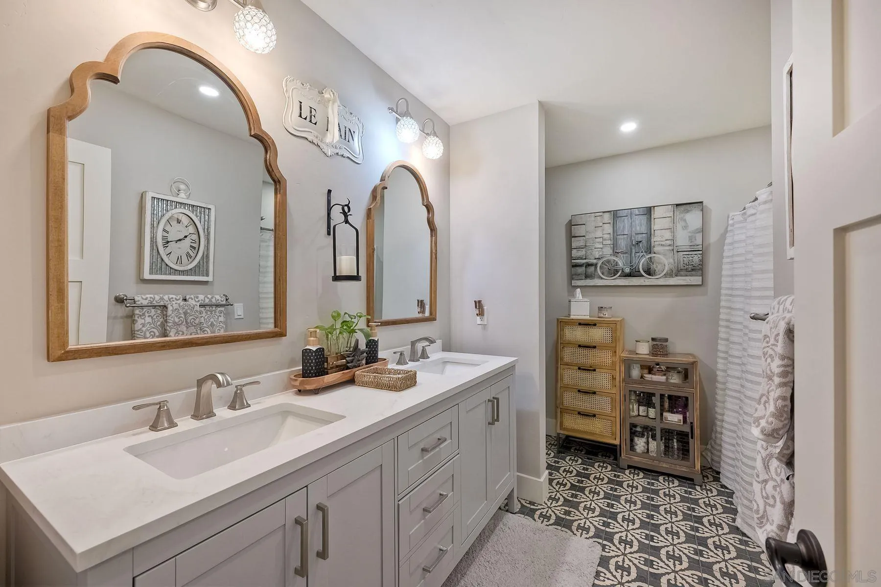 660 Via Rancho Parkway Escondido, CA 92029 - Photo 23 of 37 a spacious bathroom with a double vanity sink a mirror and a shower