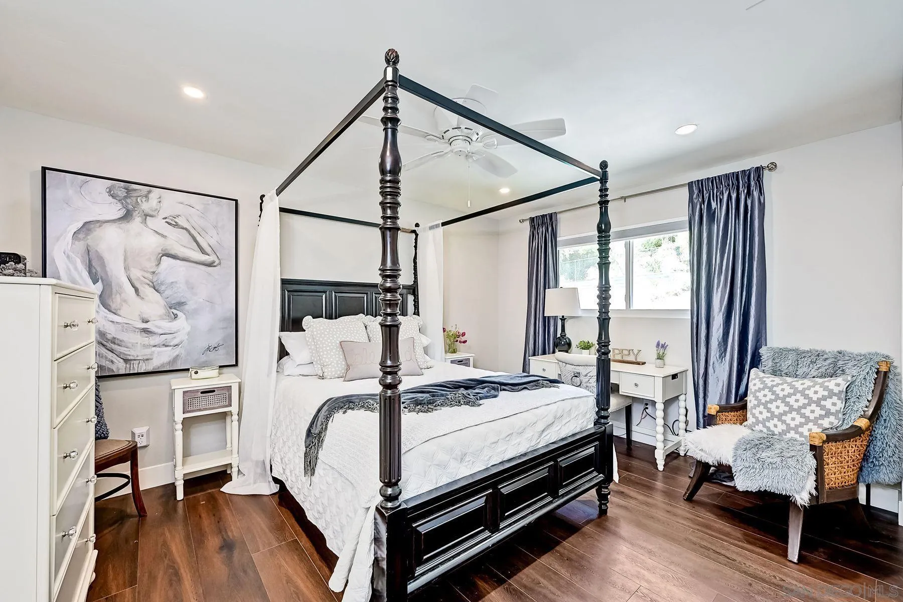 660 Via Rancho Parkway Escondido, CA 92029 - Photo 24 of 37 a bedroom with a bed and wooden floor