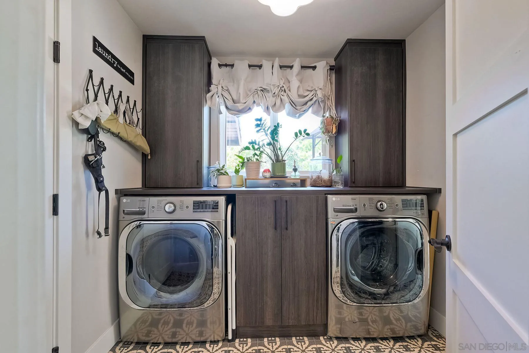 660 Via Rancho Parkway Escondido, CA 92029 - Photo 26 of 37 a view of washer and dryer in a utility room