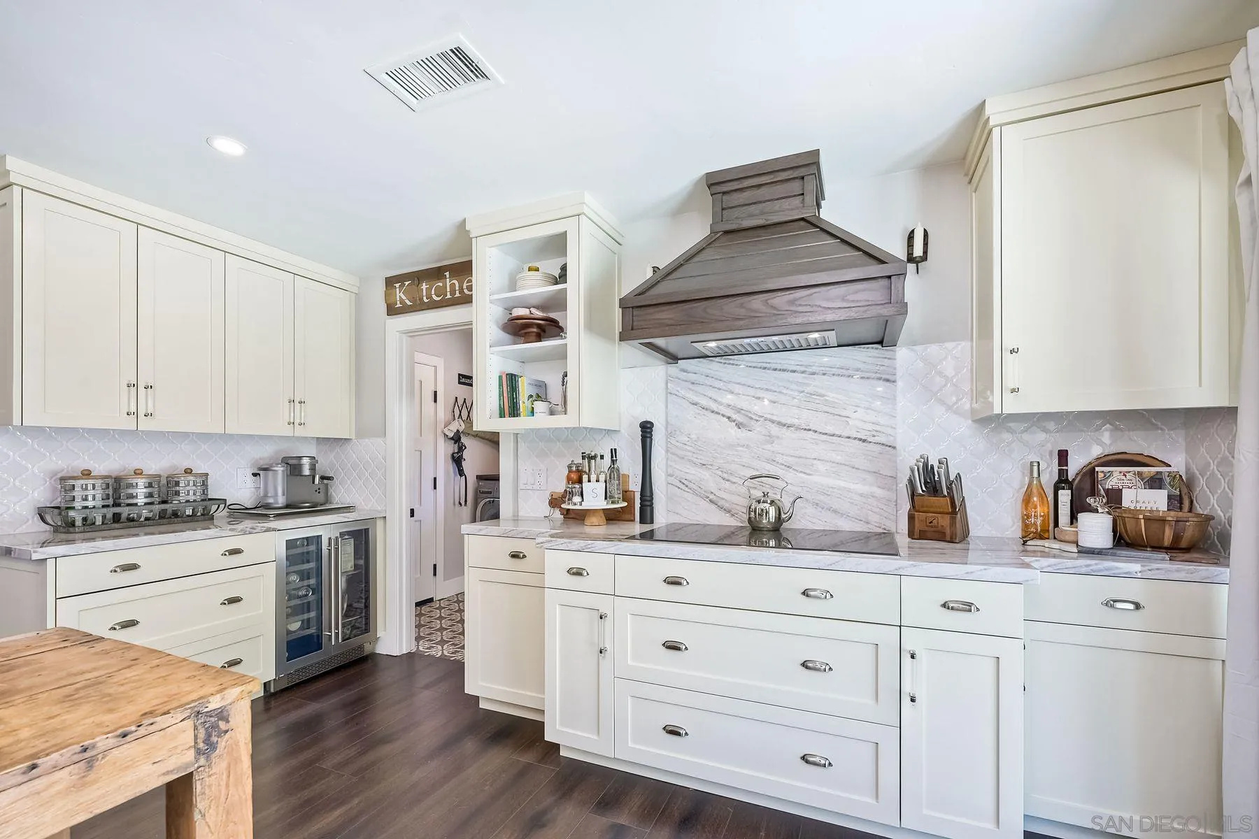 660 Via Rancho Parkway Escondido, CA 92029 - Photo 10 of 37 a kitchen with granite countertop white cabinets and white appliances