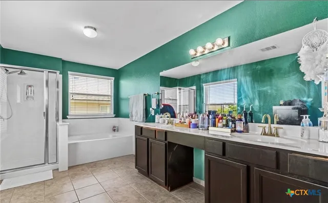 a kitchen with a sink appliances and cabinets