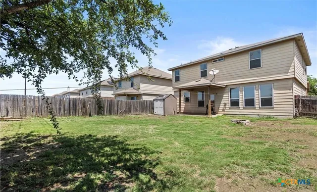 a house view with a garden space