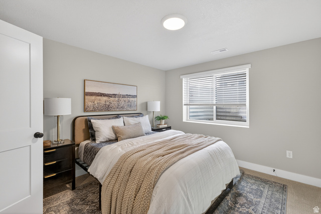 2841 West 2705 North, Unit 69 Ogden, UT 84404 - Photo 27 of 31 Bedroom featuring light neutral wall paint, a single window with horizontal blinds, and a flush-mount ceiling light fixture