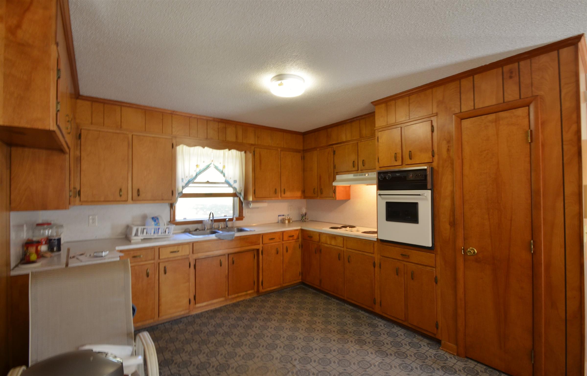 7790 Lebanon Road Mount Juliet, TN 37122 - Photo 5 of 11 a kitchen with stainless steel appliances granite countertop a sink and cabinets with wooden floor