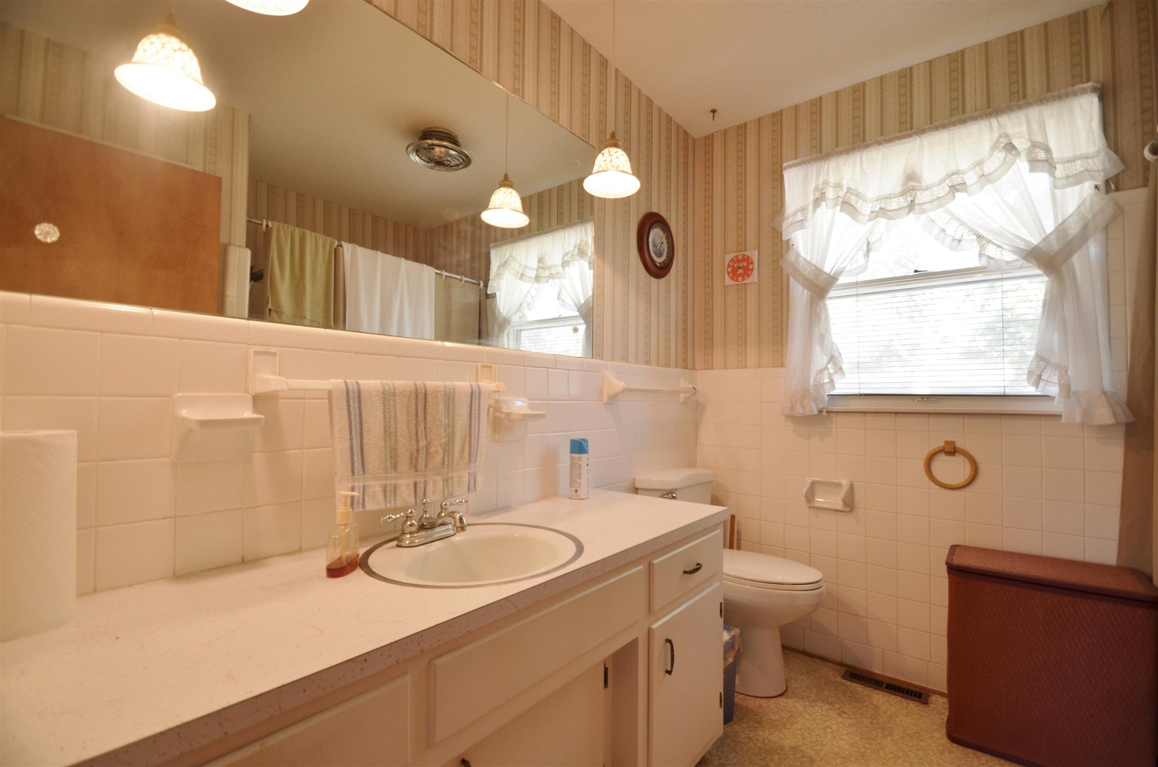 7790 Lebanon Road Mount Juliet, TN 37122 - Photo 6 of 11 a bathroom with a sink double vanity and a large mirror