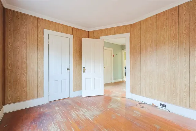 a view of a big room with closet and chandelier fan