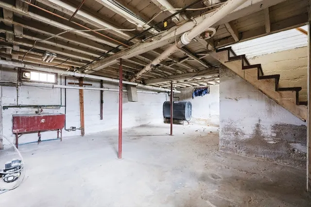 a view of a empty room with wooden floor