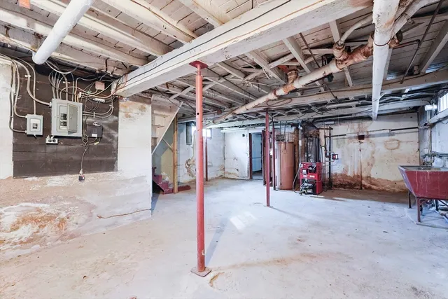a view of empty room with wooden ceiling
