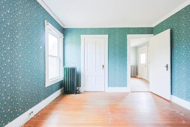 a view of a big room with windows and closet
