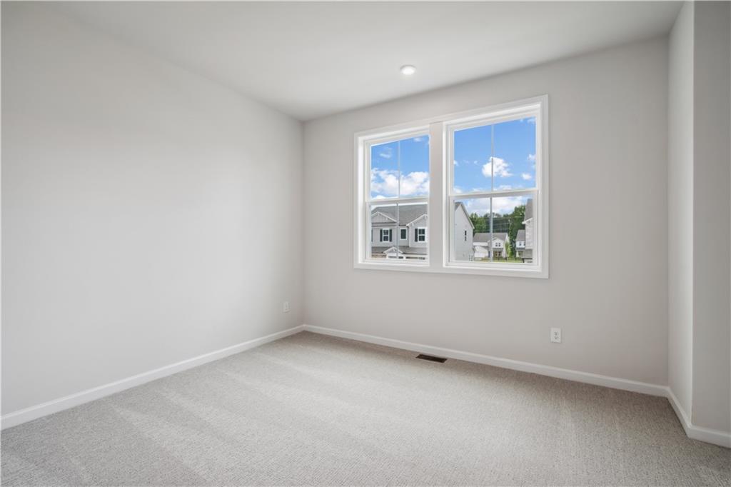 719 Crossroad Court Southwest Powder Springs, GA 30127 - Photo 25 of 27 an empty room with windows