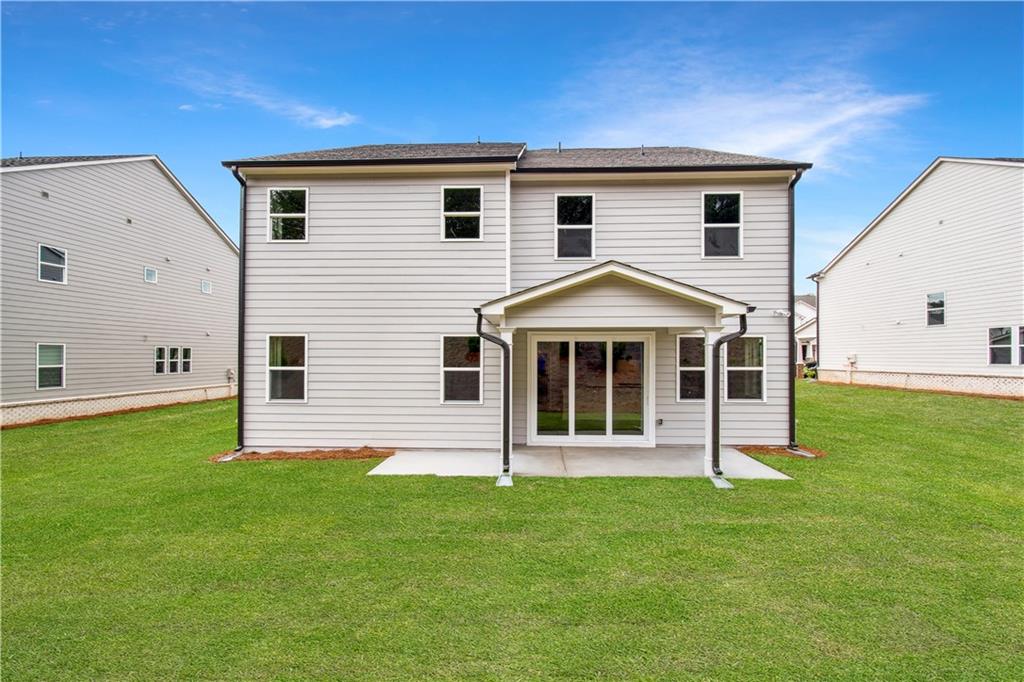 719 Crossroad Court Southwest Powder Springs, GA 30127 - Photo 27 of 27 a view of a house with a yard