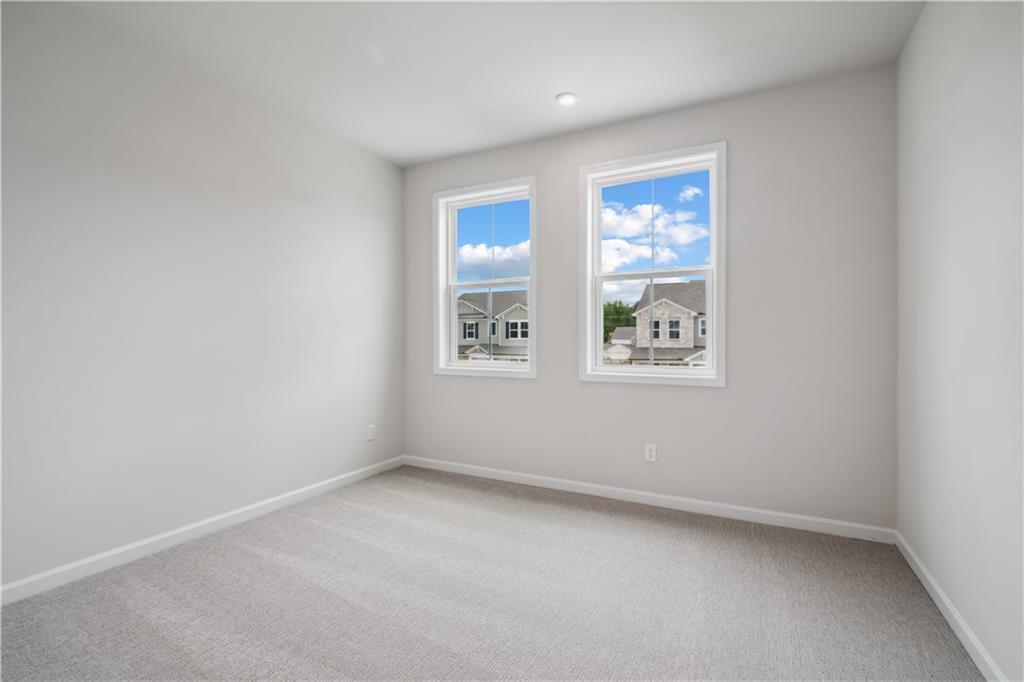719 Crossroad Court Southwest Powder Springs, GA 30127 - Photo 7 of 27 an empty room with windows