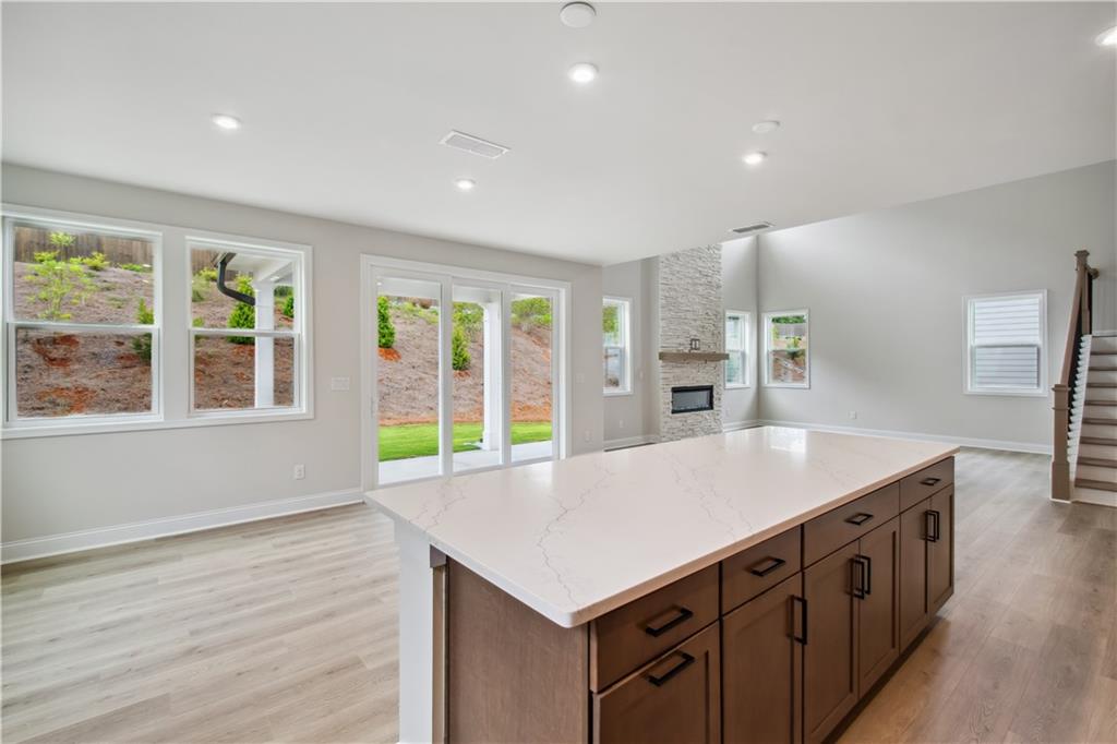 719 Crossroad Court Southwest Powder Springs, GA 30127 - Photo 9 of 27 a kitchen that has a lot of counter space and wooden floor