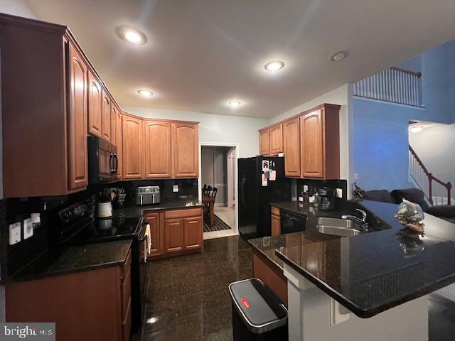 3659 White Hall Road King George, VA 22485 - Photo 13 of 36 a kitchen with stainless steel appliances granite countertop a sink refrigerator and cabinets
