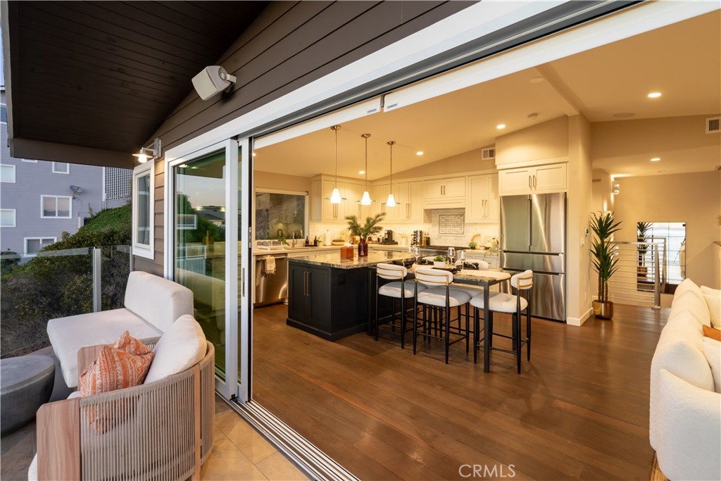 2192 Crestview Drive Laguna Beach, CA 92651 - Photo 12 of 54 a living room with lots of furniture and kitchen view