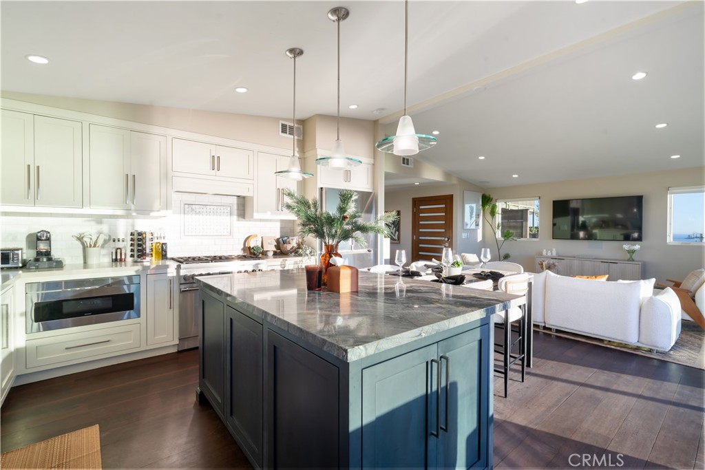 2192 Crestview Drive Laguna Beach, CA 92651 - Photo 13 of 54 a kitchen with stainless steel appliances granite countertop a stove and a view of kitchen