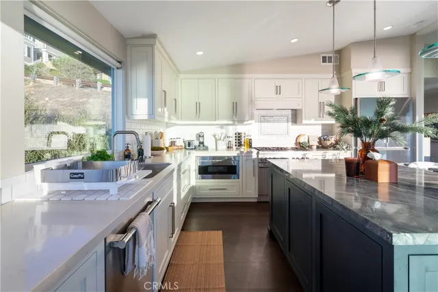 a kitchen with sink cabinets and window