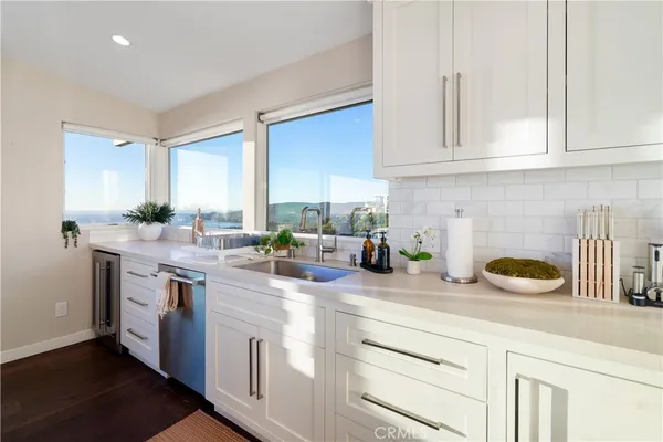 a close view of a stove a microwave and cabinets