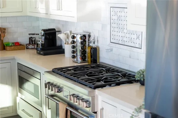 a kitchen with a sink and white appliances