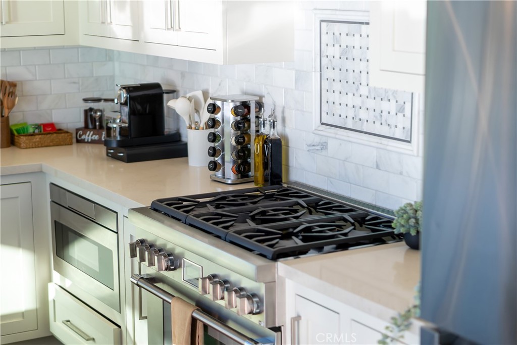 2192 Crestview Drive Laguna Beach, CA 92651 - Photo 16 of 54 a close view of a stove a microwave and cabinets
