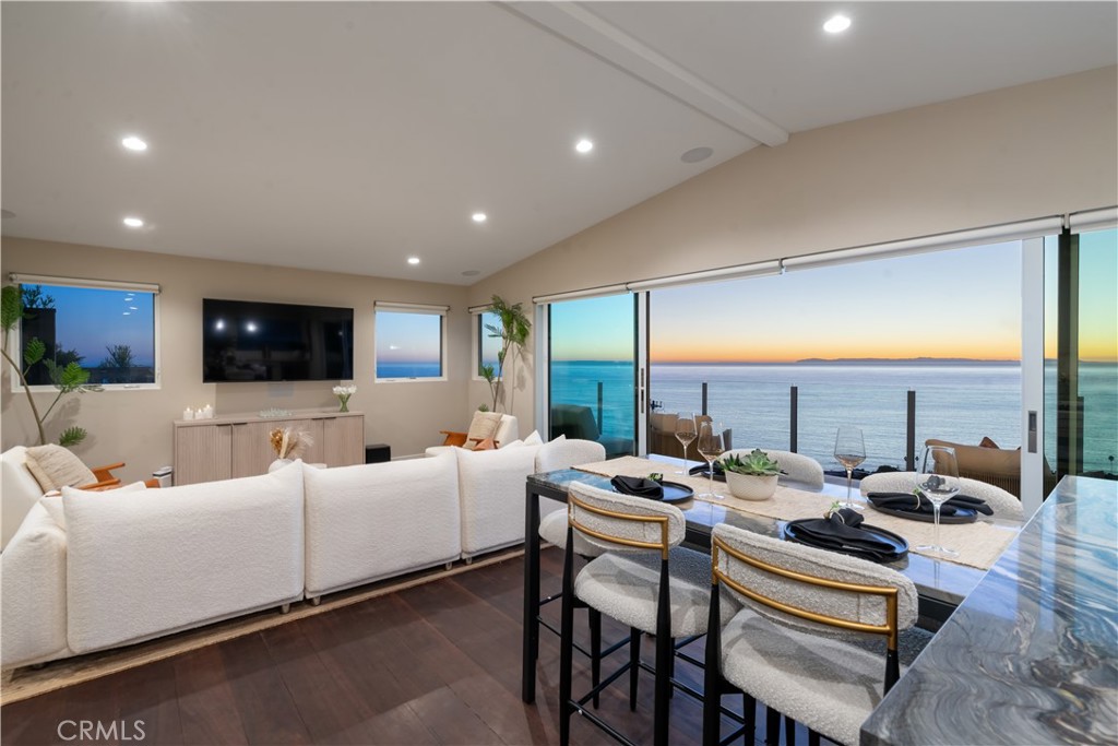 2192 Crestview Drive Laguna Beach, CA 92651 - Photo 21 of 54 a living room with furniture kitchen view and a large window