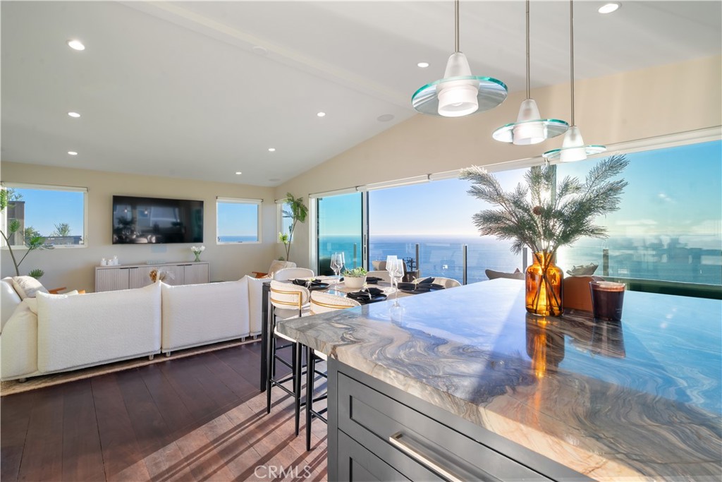 2192 Crestview Drive Laguna Beach, CA 92651 - Photo 22 of 54 a living room with fireplace furniture and a chandelier