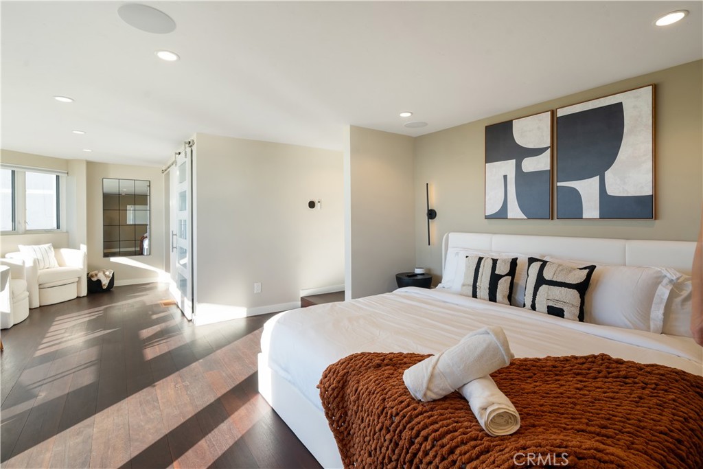 2192 Crestview Drive Laguna Beach, CA 92651 - Photo 26 of 54 a bedroom with a large bed and a couch