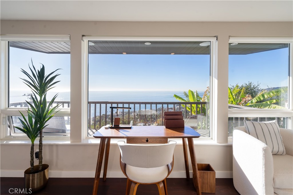 2192 Crestview Drive Laguna Beach, CA 92651 - Photo 28 of 54 a view of a dining room with furniture window and wooden floor