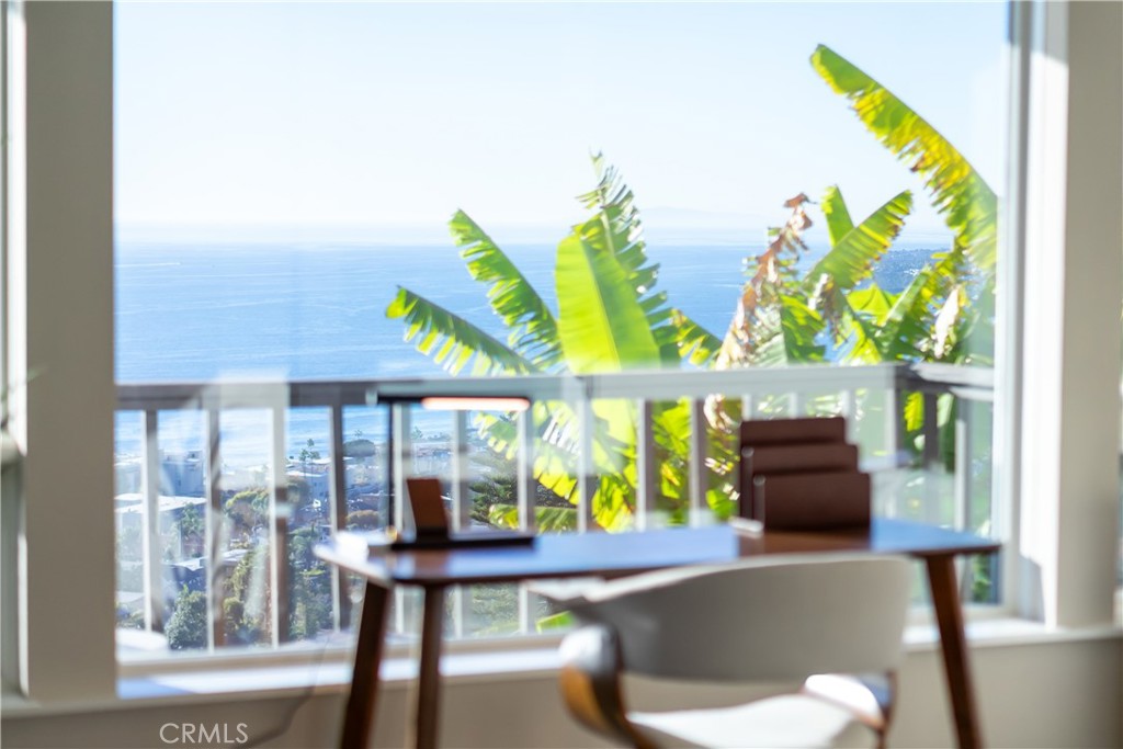2192 Crestview Drive Laguna Beach, CA 92651 - Photo 29 of 54 a living room with furniture and a floor to ceiling window