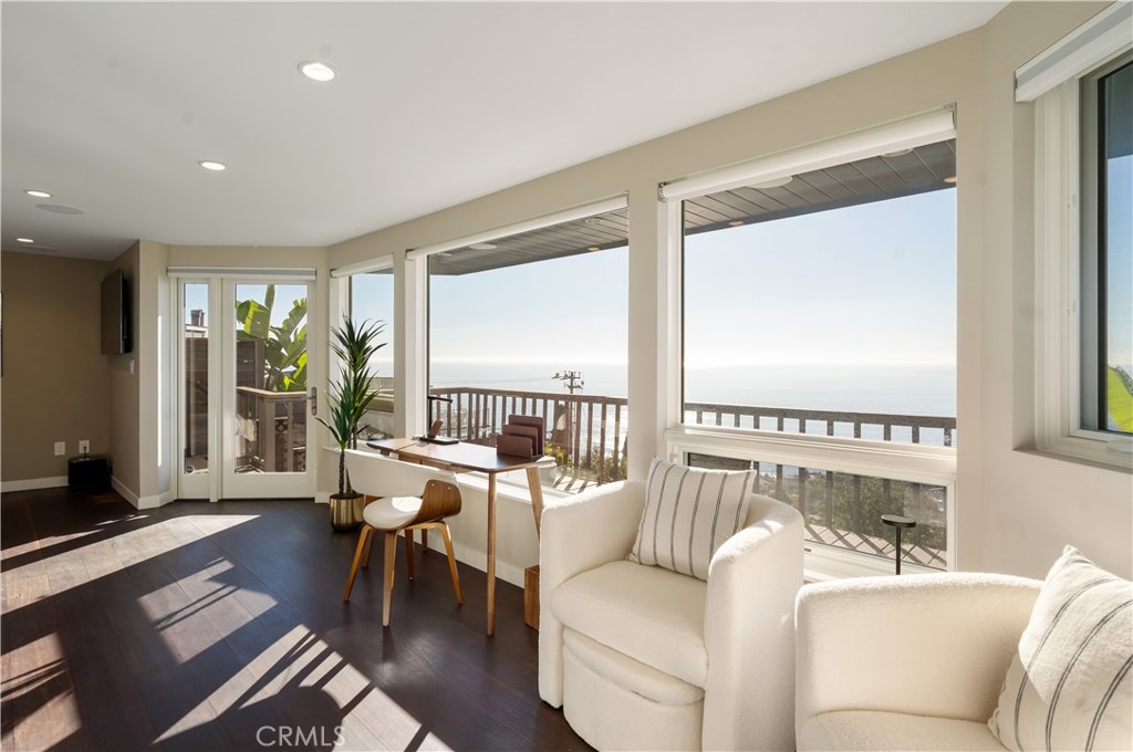 2192 Crestview Drive Laguna Beach, CA 92651 - Photo 30 of 54 a living room with furniture and a large window