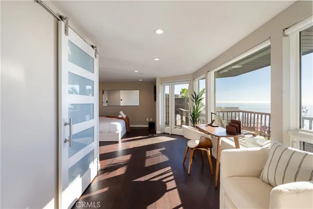 a bathroom with a granite countertop sink a toilet and a mirror