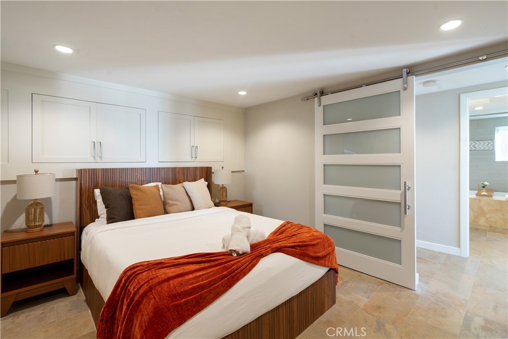 2192 Crestview Drive Laguna Beach, CA 92651 - Photo 37 of 54 a bedroom with a bed and a cabinets