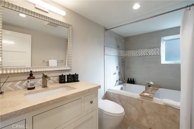 a bedroom with a bed and a lamp