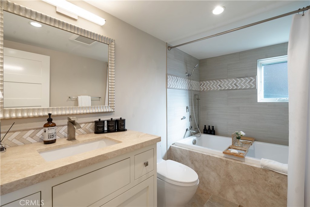 2192 Crestview Drive Laguna Beach, CA 92651 - Photo 38 of 54 a bathroom with a granite countertop sink mirror vanity and toilet